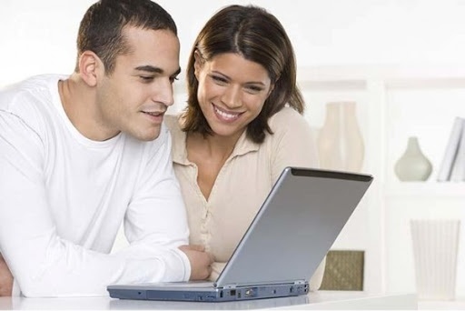 Couple looking at computer